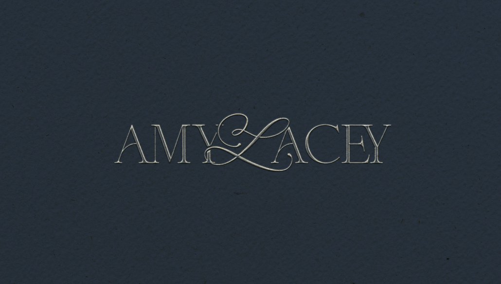 Amy Lacey signature wordmark on textured deep blue