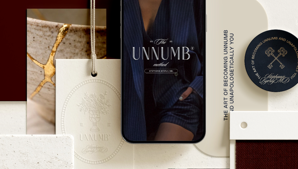 UNNUMB brand applications across a phone display, tags, and embossed stationery
